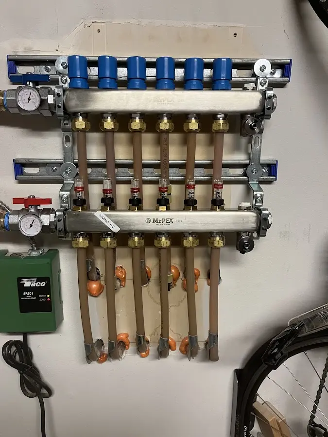 Plumber performing Water Heater Repair at a residential property in Bergenfield